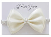 LilPinkGoose baby baptism headband in white satin bow with pearl rhinestones for christening photos.