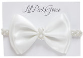 LilPinkGoose baptism headband with pearl rhinestone bow for christening ceremonies.