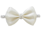 LilPinkGoose baptism headband with satin bow and cream pearls for christening photos.