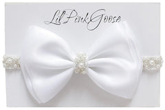 LilPinkGoose baptism headband with satin bow and pearl rhinestones for christening photos.
