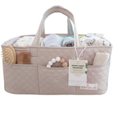 Lily Miles diaper caddy with quilted finish organizes newborn essentials at the changing station.