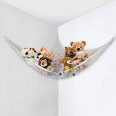 Little Chicks corner-net hammock installed in a cozy corner for plush storage.