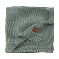 Little Dedi Alina blanket green folded for quick snuggles and compact nursery storage.