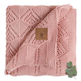 Little Dedi hypoallergenic baby blanket pink folded for quick swaddling.