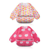 Little Dimsum pink bib front view with adjustable closure for secure feeding