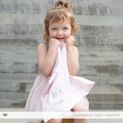 Little Giraffe Luxe mini blanky satin border detail highlighting refined baby touch.