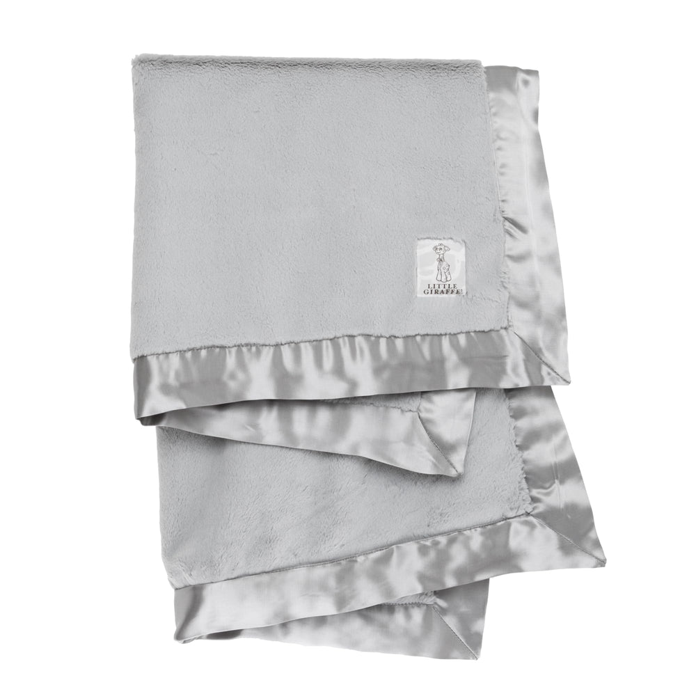Little Giraffe Luxe soft blanket with satin trim delivers cozy warmth and soothing comfort during baby snuggles.
