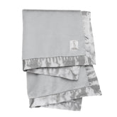 Little Giraffe Luxe soft blanket with satin trim delivers cozy warmth and soothing comfort during baby snuggles.