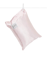 Little Giraffe Satin Decor Pillow closeup reveals feather yarn knit for ultra-soft comfort.