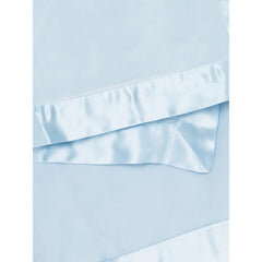 Little Giraffe velvet blanket satin trim closeup — luxurious satin detail enhances gentle touch.