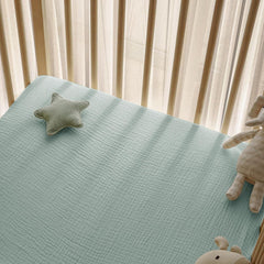 Little Grape Land muslin sheets 360° fit on standard crib ensures snug, secure bedding.