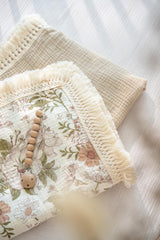 Little Jump muslin throw blanket draped for cozy nap time.