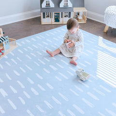 Little Landings Shoreline 6x6ft play mat provides a soft, cushioned surface for tummy time.
