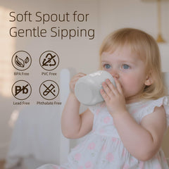 Little Rawr sippy cup with easy-grip handles promotes confident self-feeding for toddlers.