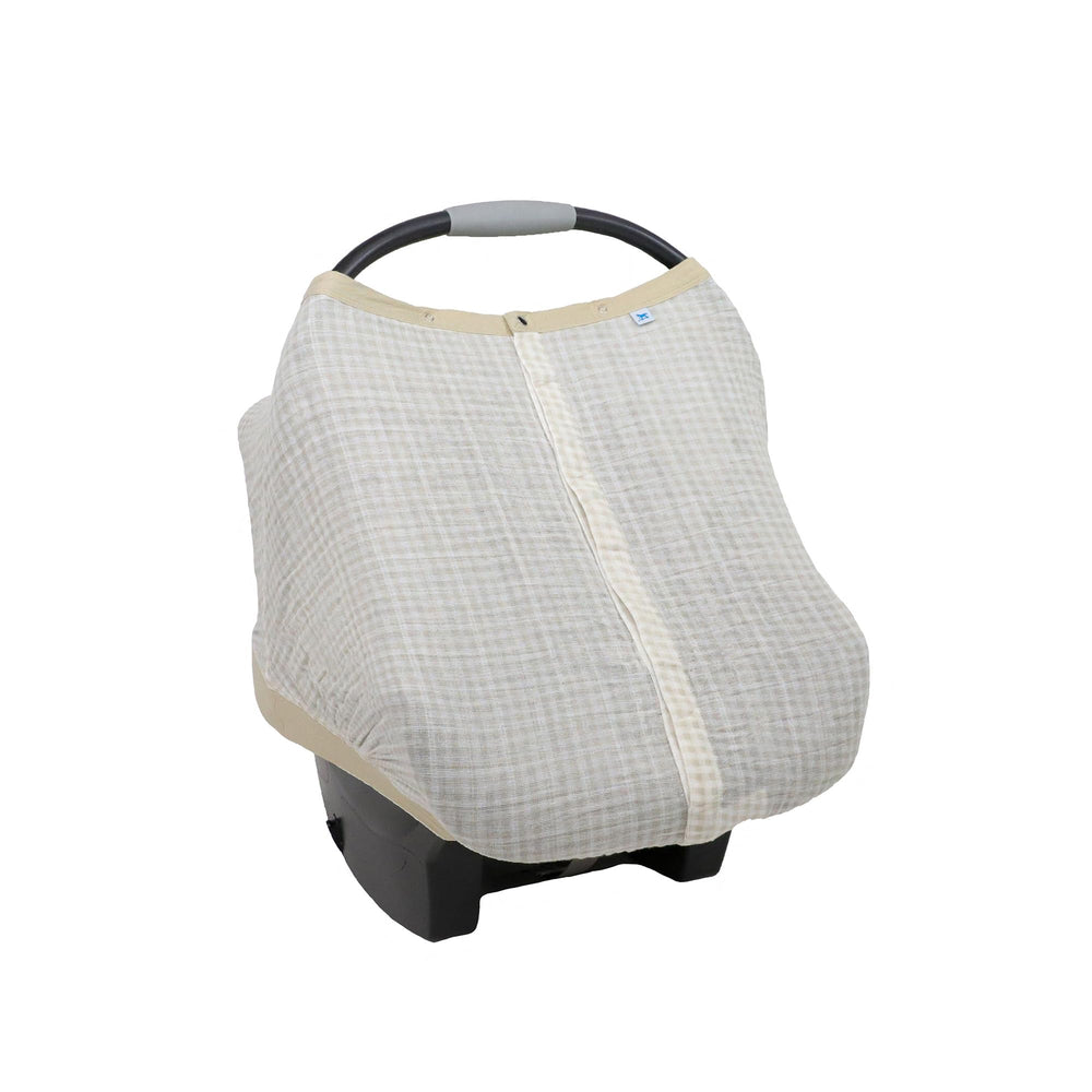 Little Unicorn breathable car seat canopy with magnetic closure provides privacy and weather protection.