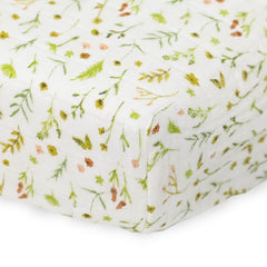Little Unicorn changing pad cover Floral Field on changing pad shows snug elastic edge.