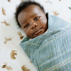 Little Unicorn Crib Sheet breathable muslin fabric promotes comfortable sleep through warm nights.
