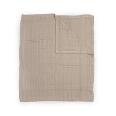 Little Unicorn Deluxe Muslin Quilt on crib for cozy nap-time comfort.