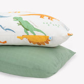 Little Unicorn dino names pillowcase close-up highlights plush muslin for cozy, breathable kid sleep