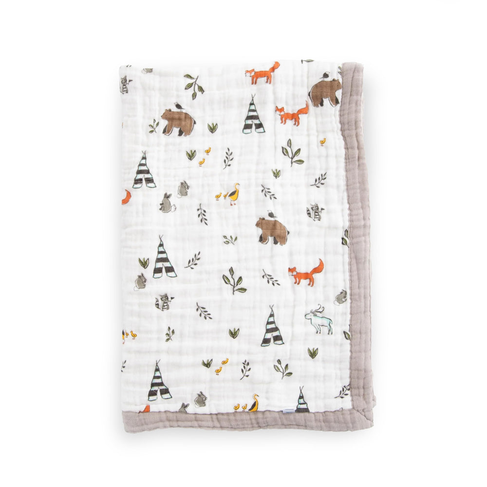 Little Unicorn Forest Friends quilt folded showing ultra-soft four-layer muslin for cozy cuddles.