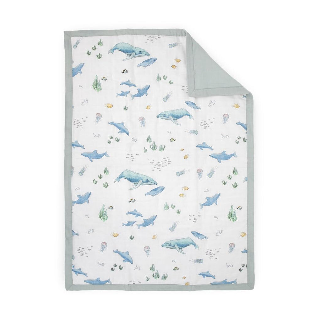 Little Unicorn Lofty Comforter whales close-up shows soft, breathable warmth for bedtime.