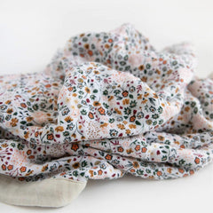 Little Unicorn newborn quilt car-seat wrap provides secure, comfortable travel snuggles.
