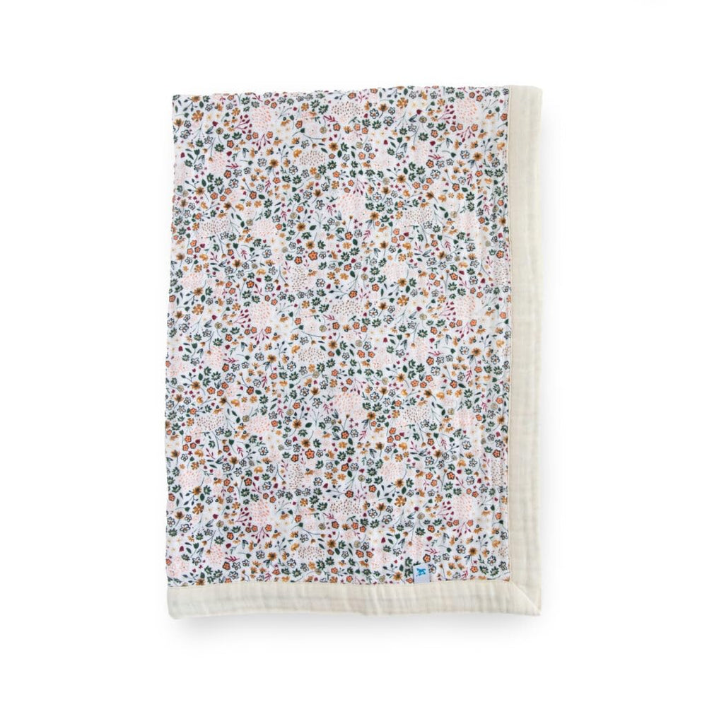 Little Unicorn newborn receiving quilt with 4-layer muslin softness for cozy cuddles.