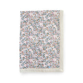 Little Unicorn newborn receiving quilt with 4-layer muslin softness for cozy cuddles.