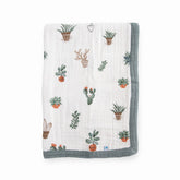 Little Unicorn newborn receiving quilt four-layer muslin close-up for soft cuddle readiness.