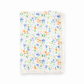 Little Unicorn newborn receiving quilt Mountain Bloom front view shows ultra-soft four-layer muslin for cozy cuddles.