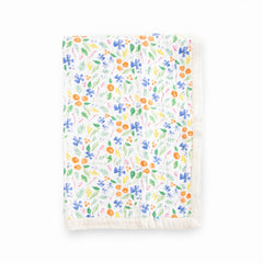 Little Unicorn newborn receiving quilt Mountain Bloom front view shows ultra-soft four-layer muslin for cozy cuddles.