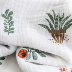 Little Unicorn premium cotton swaddle blanket showing 47x47 swaddle size for secure wrap.