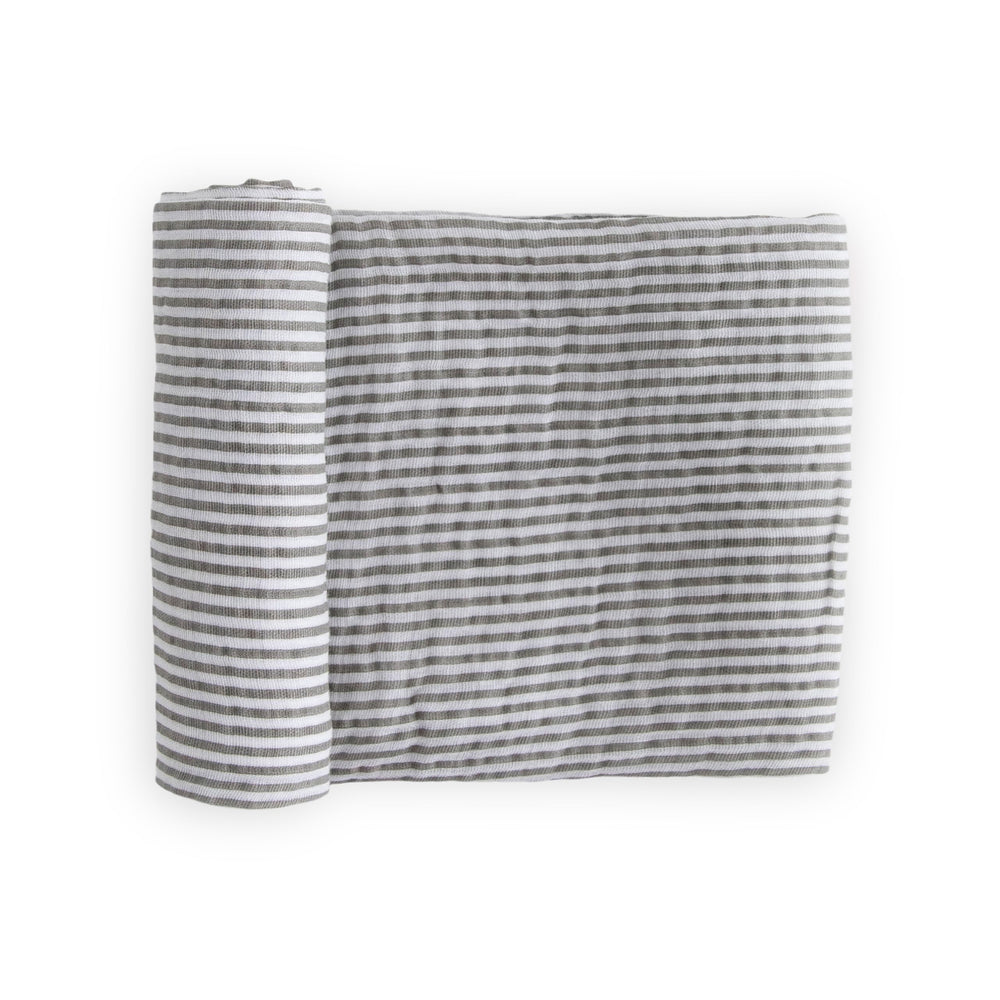 Little Unicorn premium cotton swaddle in grey stripe folded for travel and storage