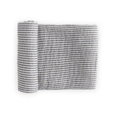 Little Unicorn premium cotton swaddle in grey stripe folded for travel and storage