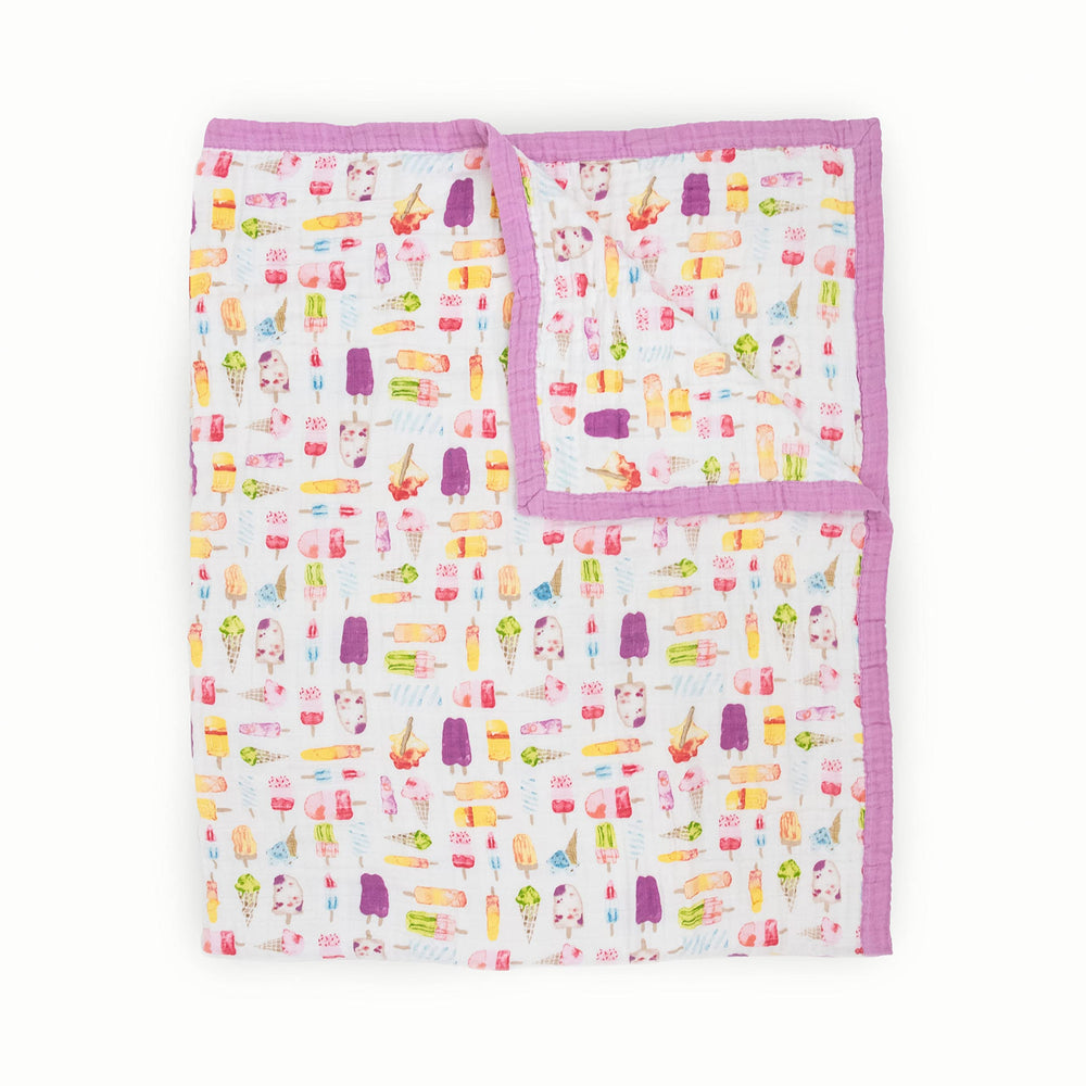Little Unicorn premium quilt close-up showing multi-layer muslin texture for soft warmth and breathable comfort