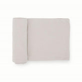 Little Unicorn premium stretch-knit swaddle blanket Pebble closeup highlights soft weave and gentle stretch for cozy swaddling.