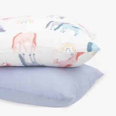 Little Unicorn standard pillowcase 2-pack shows unicorn pattern for cozy kids' sleep.
