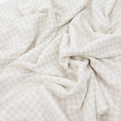 Little Unicorn stretch-knit swaddle rainbows in baby nursery conveys soft comfort