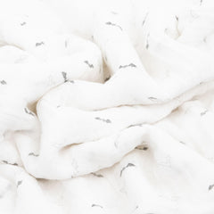 Little Unicorn swaddle blanket soft muslin texture highlights cozy mornings and gentle nursing sessions.