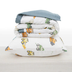 Little Unicorn work-trucks sheet demonstrates snug fit for crib mattresses.