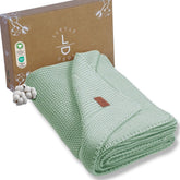 Little Dedi sage blanket folded for crib warmth and comfort