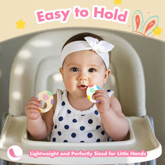 LittleLamb Easter-themed teether baby-hand shot emphasizes portability for on-the-go soothing