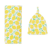 Little Sleepies lemon swaddle blanket close-up shows buttery-soft bamboo fabric for gentle newborn comfort.