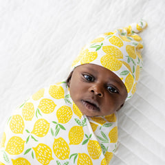 Little Sleepies lemon swaddle fabric close-up shows airy viscose from bamboo weave for breathable comfort.