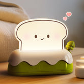 L LOHAS LED cute toaster night light shows the toaster switch for cozy bedside ambiance.