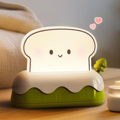 L LOHAS LED cute toaster night light shows the toaster switch for cozy bedside ambiance.
