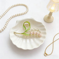 LNYMZD lily-valley flower hair clip showcases botanical charm with secure grip.