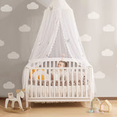LOAOL Butterfly bed canopy over crib creates a cozy, fairy-tale sleep space.