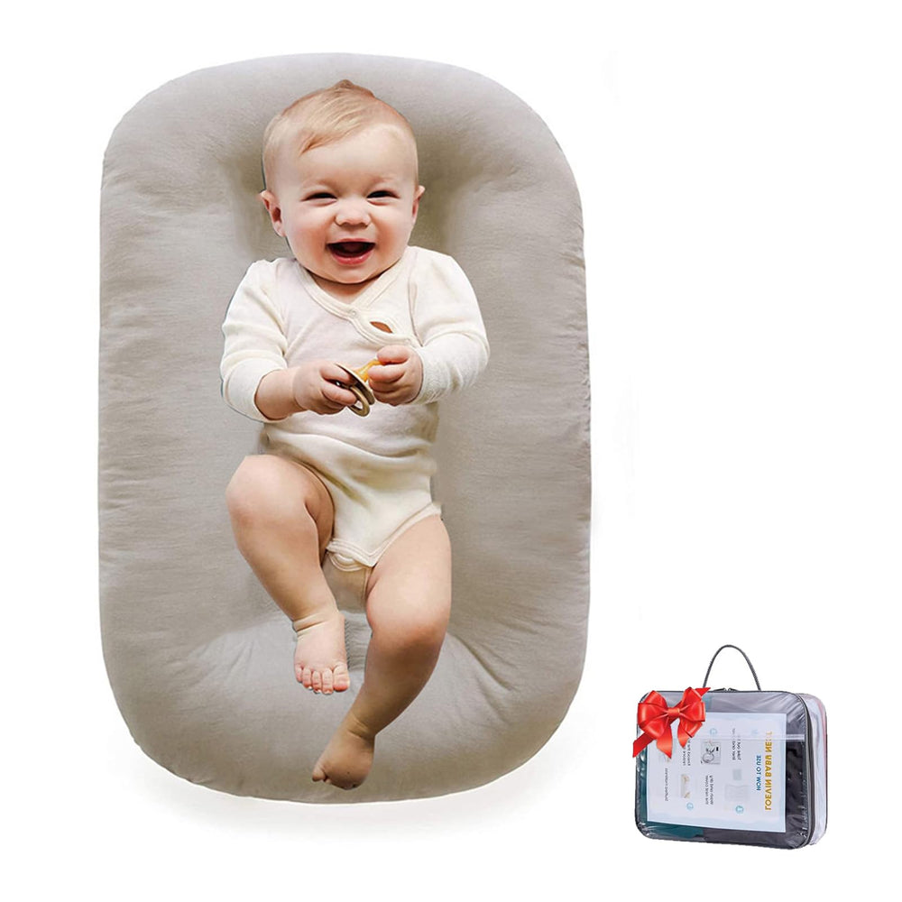 Loevin Baby Lounger with soft cotton cover for cozy infant comfort during play.
