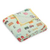 LollyBanks muslin blanket with farm theme illustration for gentle nursery snuggles.